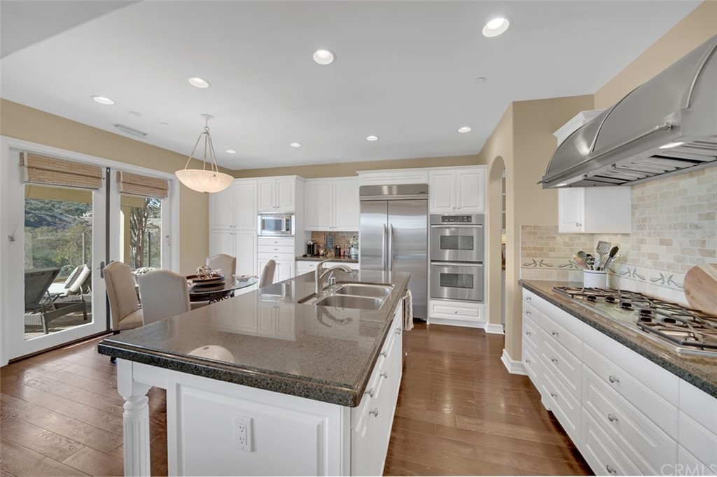 31 Via Soria San Clemente, CA 92673 - Photo 6 of 59 a kitchen with stainless steel appliances granite countertop a sink stove and refrigerator