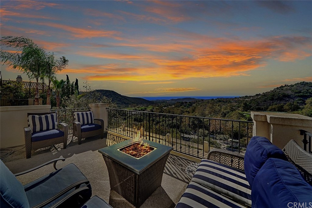 31 Via Soria San Clemente, CA 92673 - Photo 58 of 59 a view of a balcony with two chairs and a potted plant