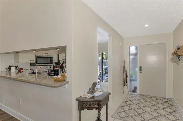 a kitchen with stainless steel appliances granite countertop a refrigerator and a stove