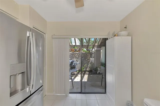 a kitchen with stainless steel appliances granite countertop a sink and white cabinets