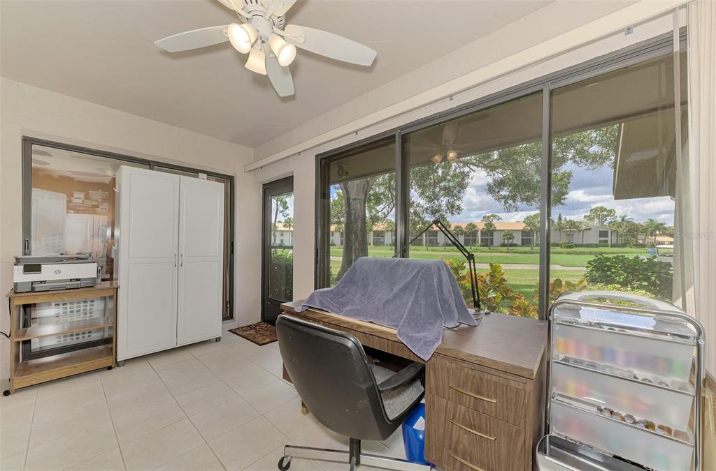 4521 Kingsmere, Unit 6 Sarasota, FL 34235 - Photo 32 of 42 a room with furniture and large windows
