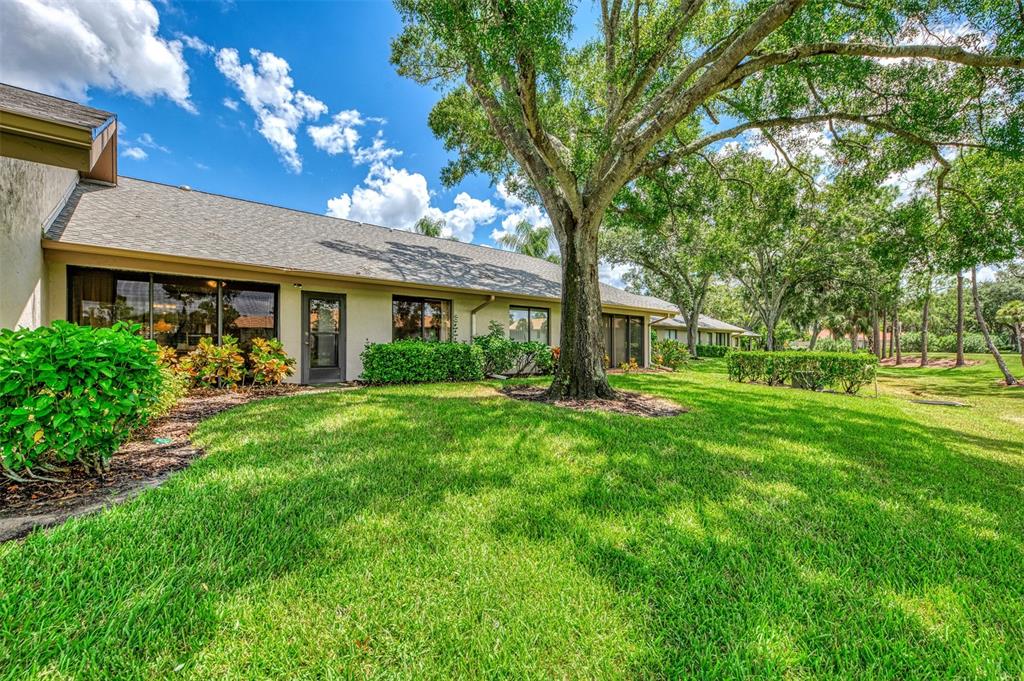 4521 Kingsmere, Unit 6 Sarasota, FL 34235 - Photo 34 of 42 a front view of a house with garden