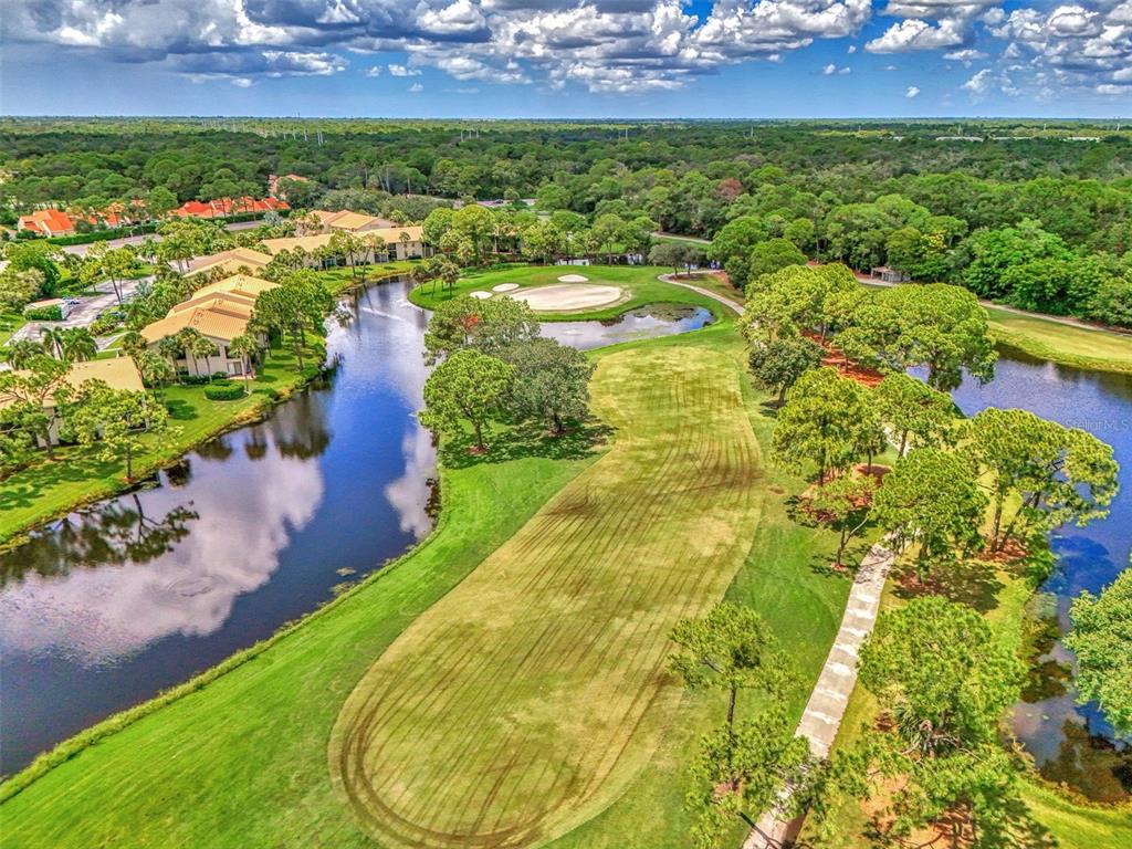 4521 Kingsmere, Unit 6 Sarasota, FL 34235 - Photo 36 of 42 an aerial view of residential houses with outdoor space and trees