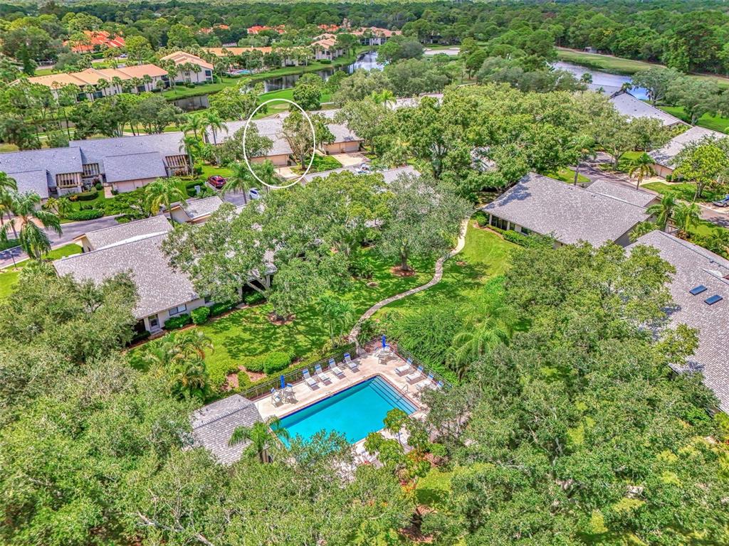 4521 Kingsmere, Unit 6 Sarasota, FL 34235 - Photo 39 of 42 an aerial view of a house with a yard and lake view