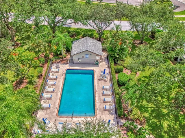 a view of swimming pool with seating space