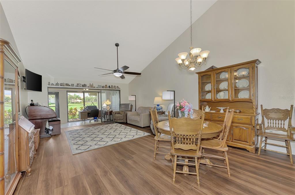 4521 Kingsmere, Unit 6 Sarasota, FL 34235 - Photo 7 of 42 a view of a dining room with furniture window and wooden floor