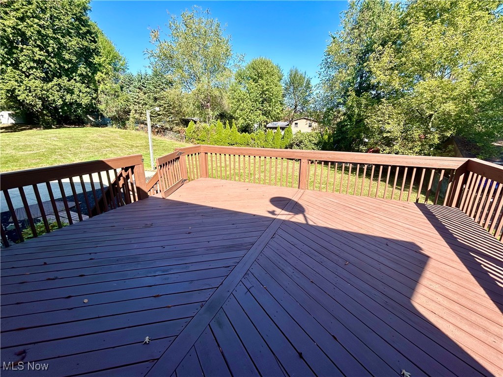 399 Abbyshire Road Green, OH 44319 - Photo 39 of 48 Deck featuring a lawn and view of trees