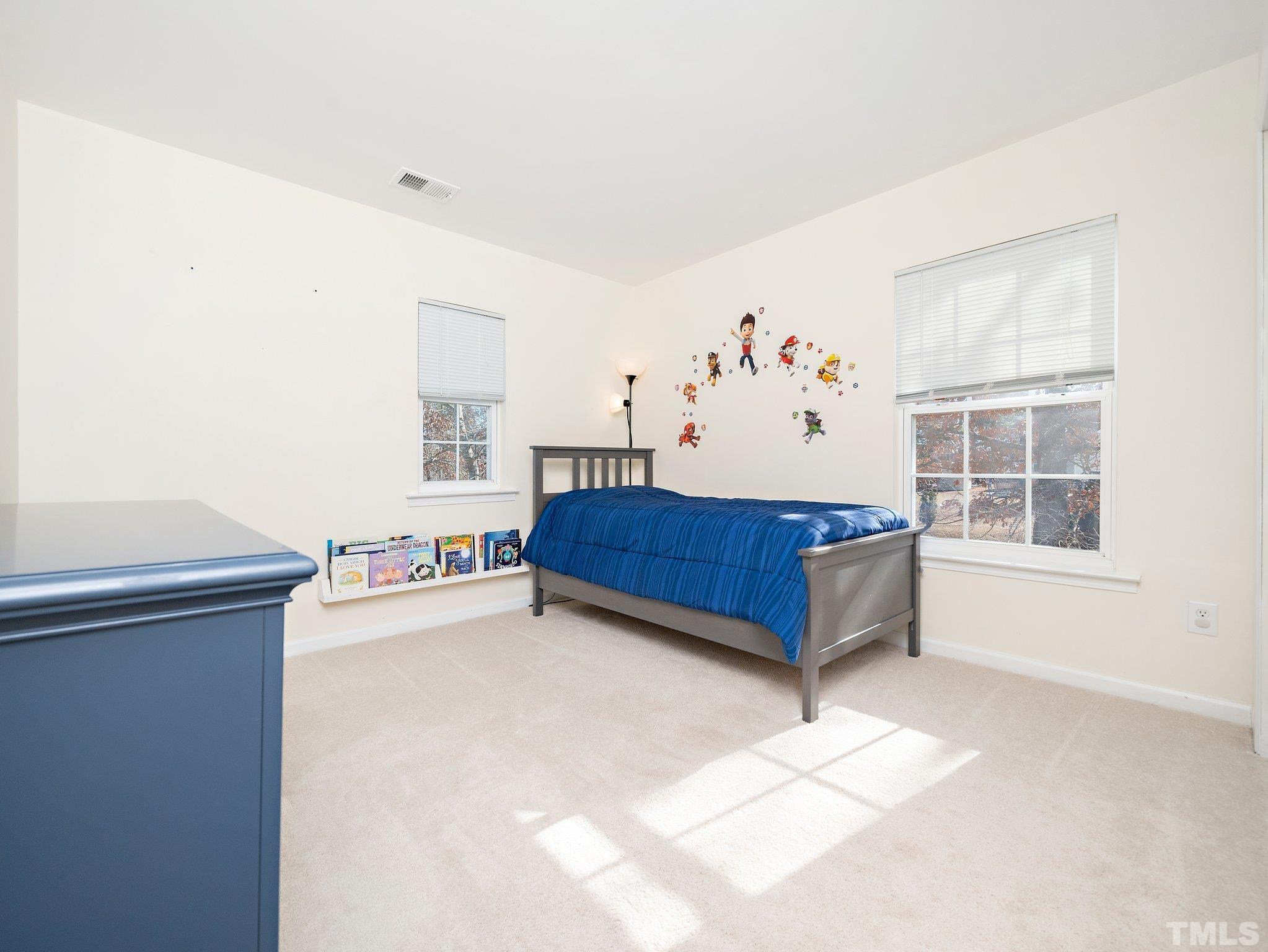 8803 Elizabeth Bennet Place Raleigh, NC 27616 - Photo 17 of 23 a living room with furniture and window