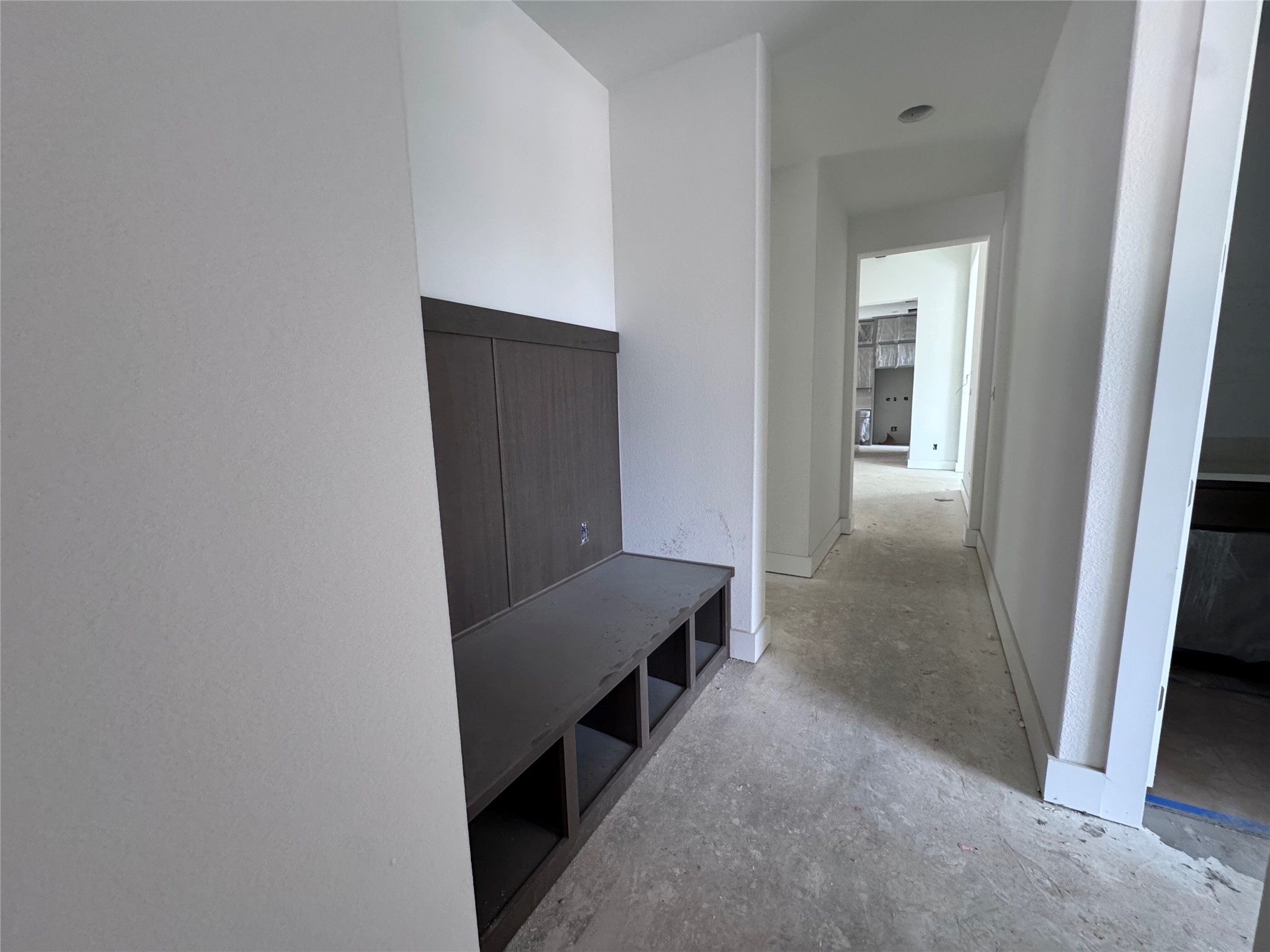 128 Rancho Deluxe Liberty Hill, TX 78642 - Photo 7 of 15 A clever built-in bench and cubby system provides storage in this functional mud room.