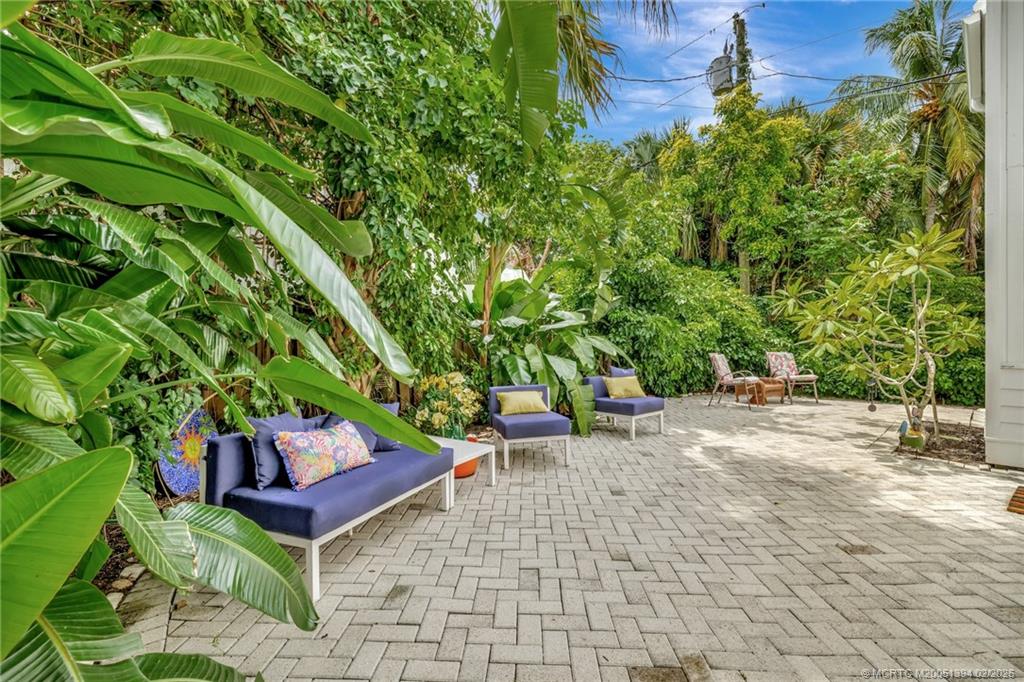 221 Coconut Avenue Stuart, FL 34996 - Photo 15 of 20 a view of a backyard with sitting area
