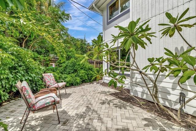 221 Coconut Avenue Stuart, FL 34996 - Photo 16 of 20 a view of a chairs in a backyard