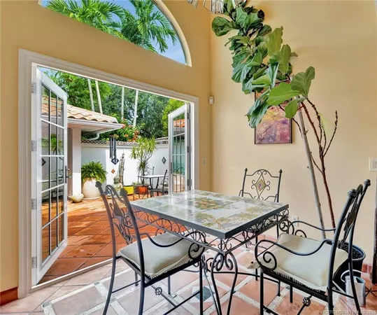 a view of an outdoor space with furniture and garden