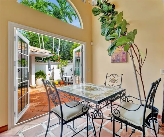 a view of an outdoor space with furniture and garden