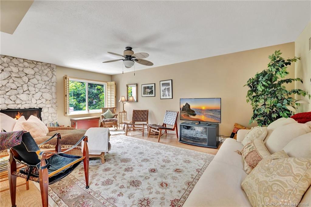 221 Coconut Avenue Stuart, FL 34996 - Photo 7 of 20 a living room with furniture and a flat screen tv