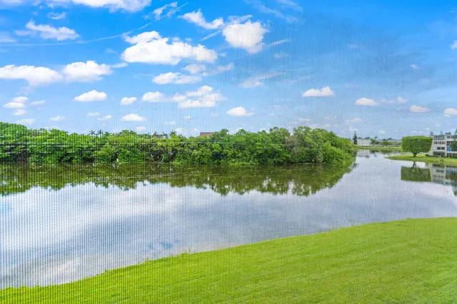 a view of a lake with a big yard