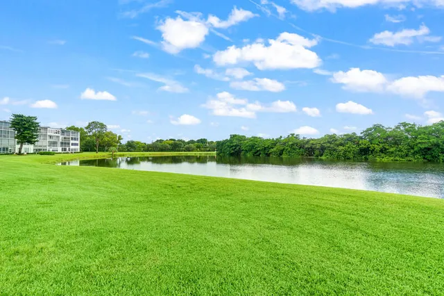 a view of a lake with houses in the back