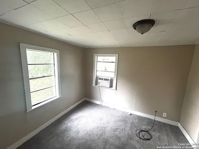 a view of an empty room and window