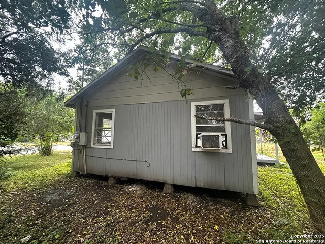 a house with a tree in front of it