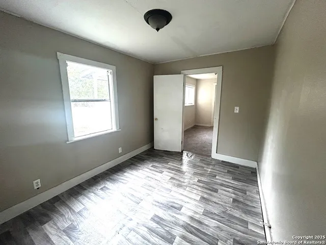 a view of an empty room and window