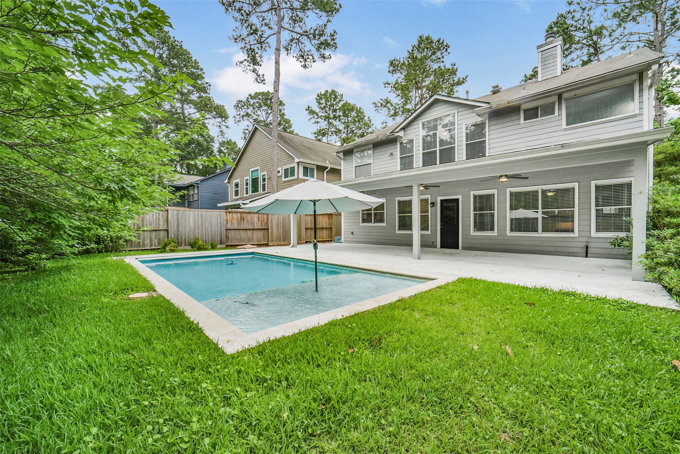 22 East New Avery Place Spring, TX 77382 - Photo 4 of 46 Outdoor modern pool with large patio.