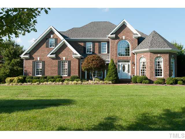 502 Mason Road Durham, NC 27712 - Photo 1 of 25 a front view of a house with a yard and green space