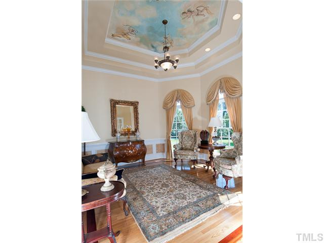 502 Mason Road Durham, NC 27712 - Photo 4 of 25 a living room with furniture and a chandelier