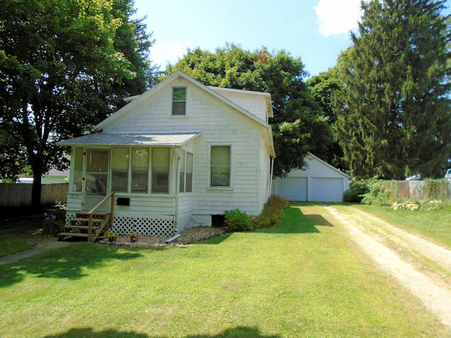 1012 North 8th Street Rochelle, IL 61068 - Photo 1 of 9 a view of backyard with table and chairs and potted plants