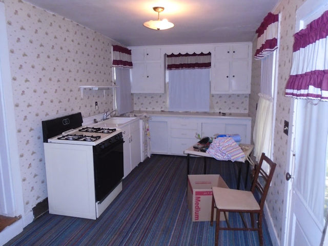 1012 North 8th Street Rochelle, IL 61068 - Photo 2 of 9 a kitchen with stainless steel appliances a stove a sink dishwasher and cabinets