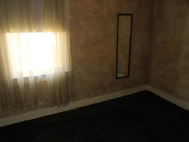 1012 North 8th Street Rochelle, IL 61068 - Photo 3 of 9 a view of a small space with wooden floor and a window