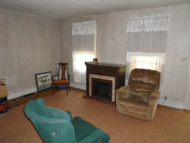 1012 North 8th Street Rochelle, IL 61068 - Photo 5 of 9 a living room with furniture and a fireplace