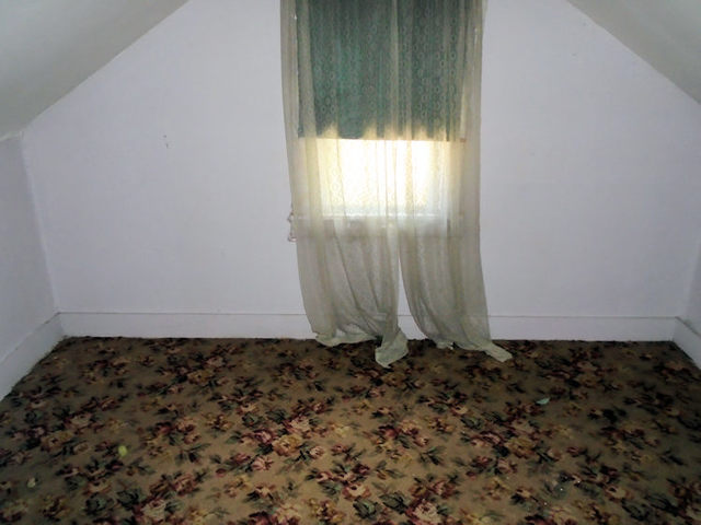 1012 North 8th Street Rochelle, IL 61068 - Photo 6 of 9 an empty room with a window