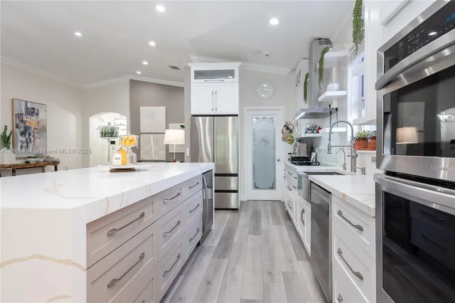 a living room with furniture a rug and a lamp