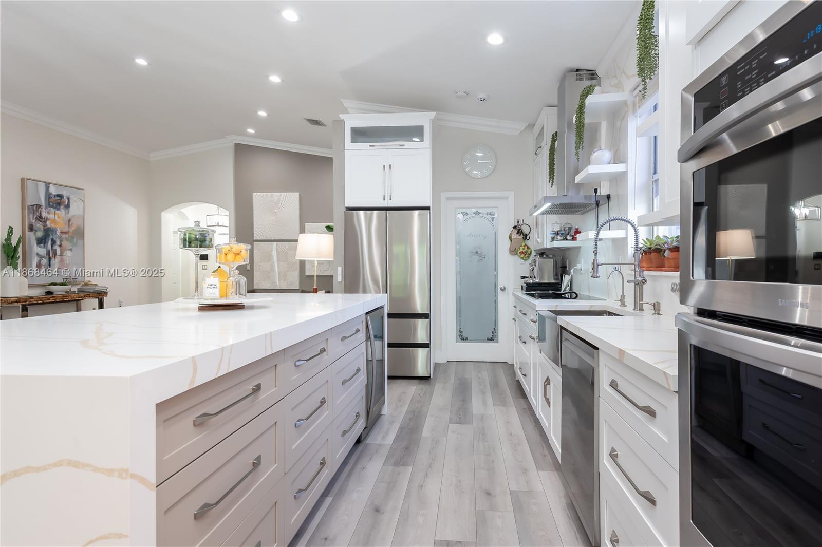 13348 Southwest 52nd Street Miramar, FL 33027 - Photo 14 of 48 a large kitchen with a lot of counter space and stainless steel appliances
