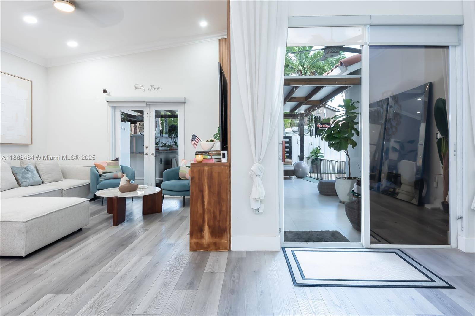 13348 Southwest 52nd Street Miramar, FL 33027 - Photo 17 of 48 a living room with furniture and a large window