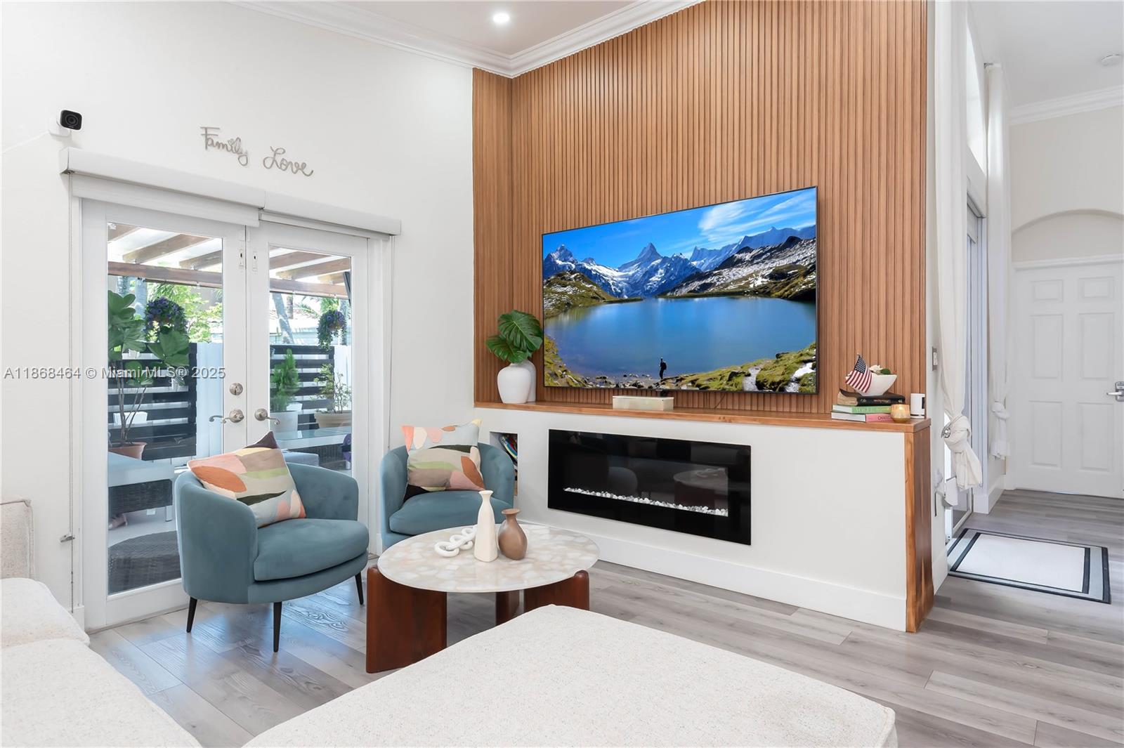 13348 Southwest 52nd Street Miramar, FL 33027 - Photo 20 of 48 a living room with furniture a fireplace and a flat screen tv