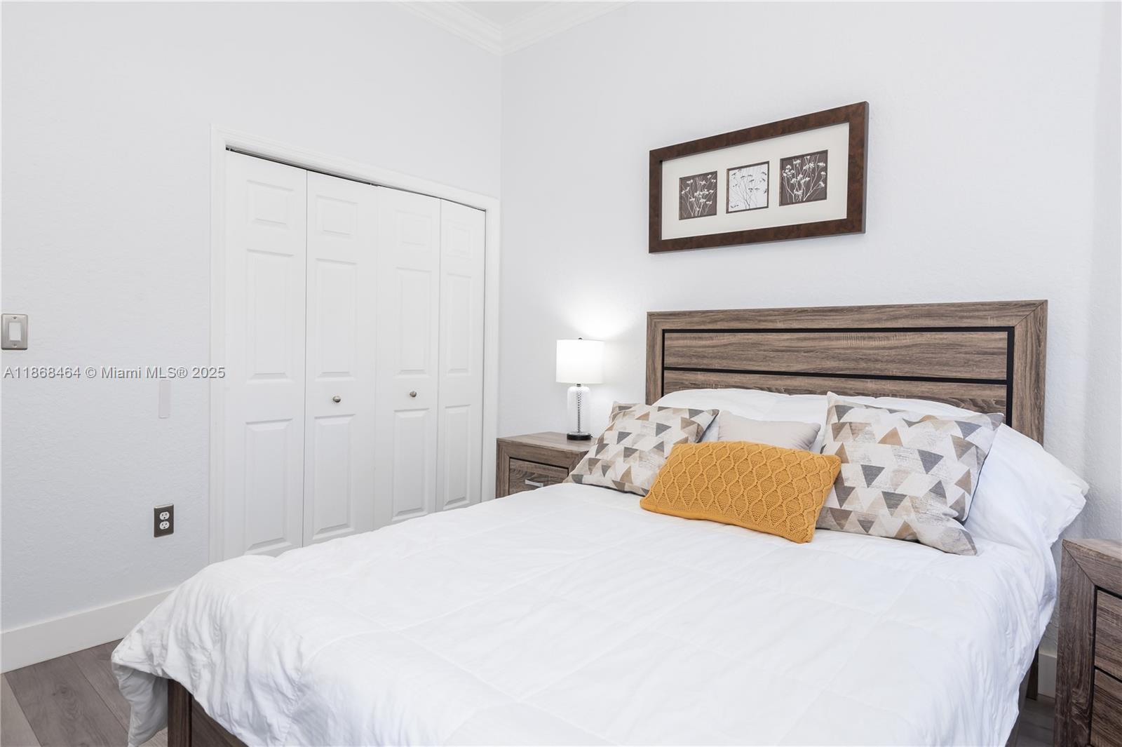 13348 Southwest 52nd Street Miramar, FL 33027 - Photo 23 of 48 a bedroom with a bed and a painting on the wall