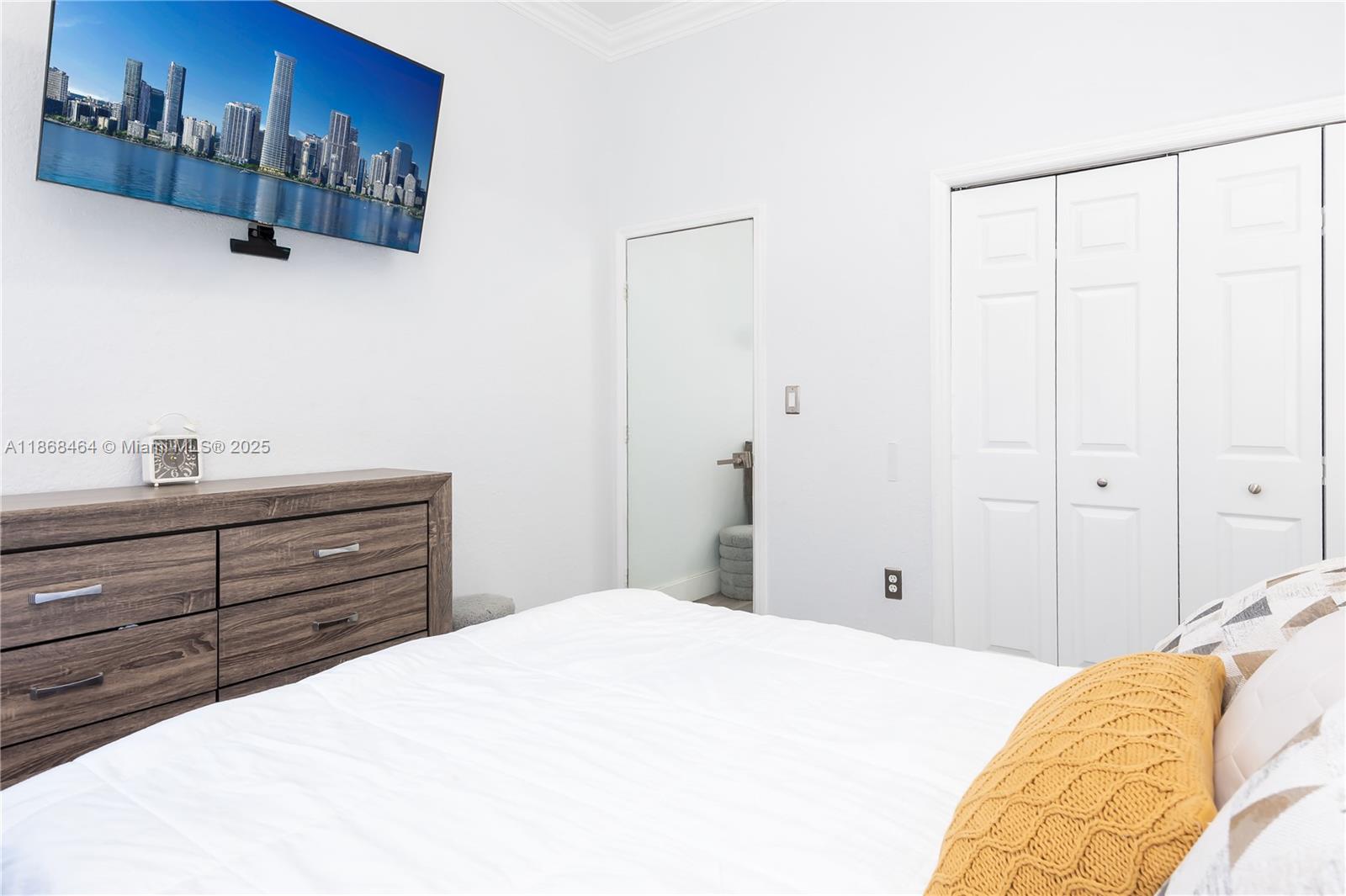 13348 Southwest 52nd Street Miramar, FL 33027 - Photo 28 of 48 a bedroom with a bed and a window