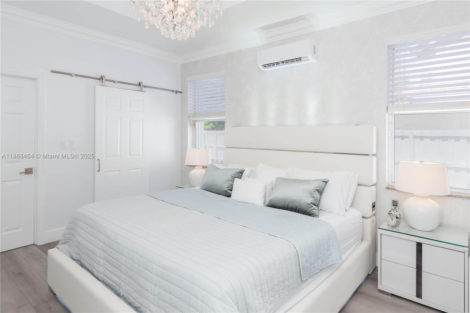 13348 Southwest 52nd Street Miramar, FL 33027 - Photo 30 of 48 a bedroom with a bed and a window