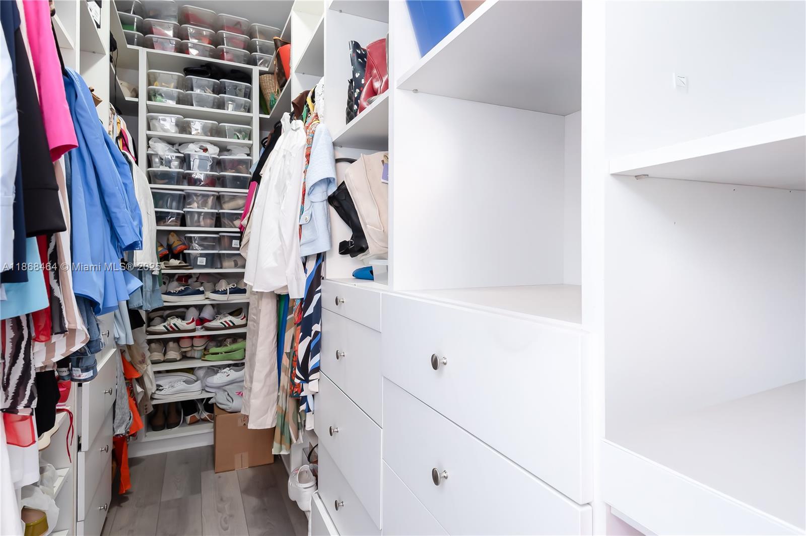 13348 Southwest 52nd Street Miramar, FL 33027 - Photo 34 of 48 a view of walk in closet with clothes and shoes