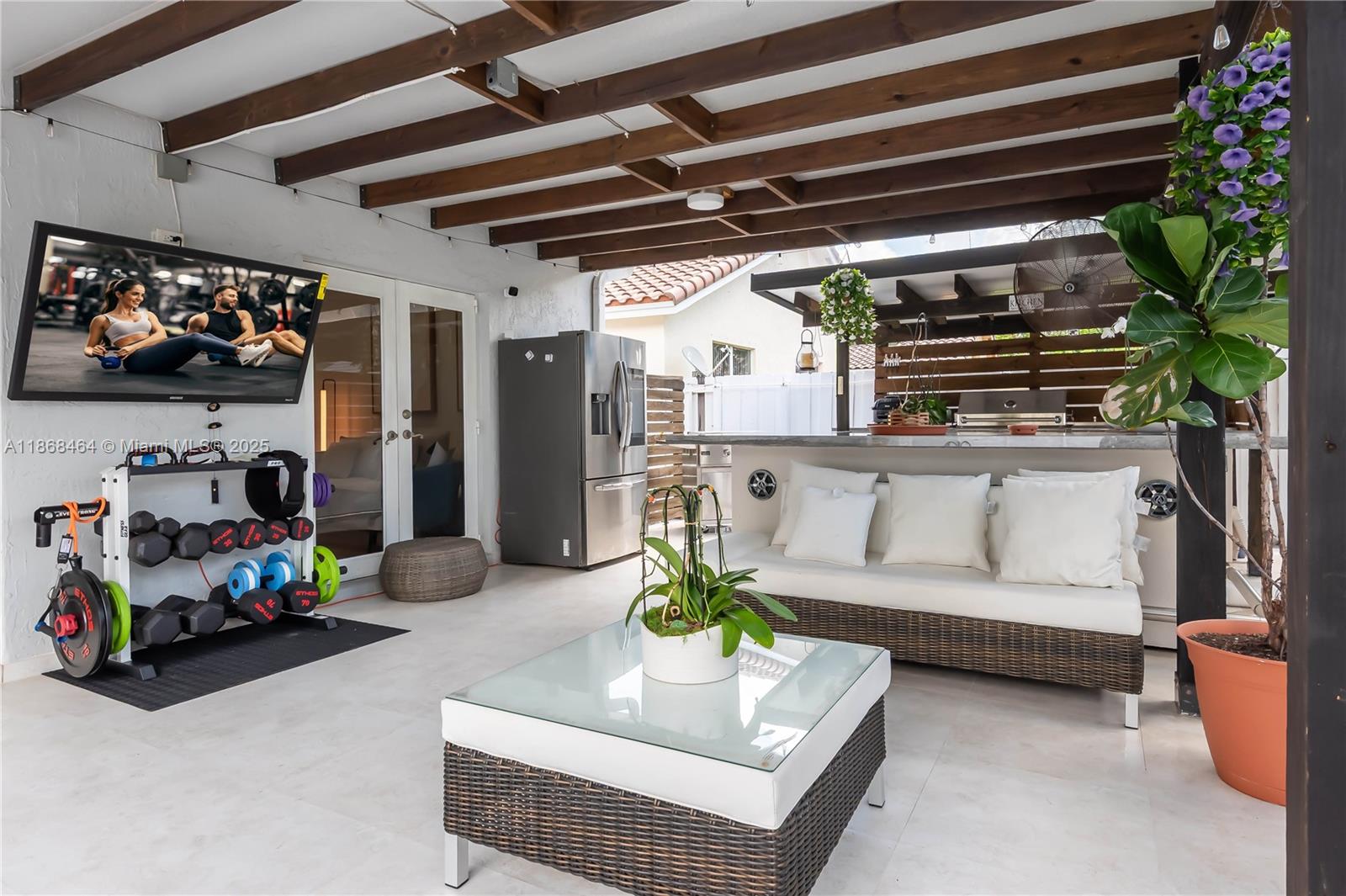 13348 Southwest 52nd Street Miramar, FL 33027 - Photo 35 of 48 a living room with furniture and a potted plant