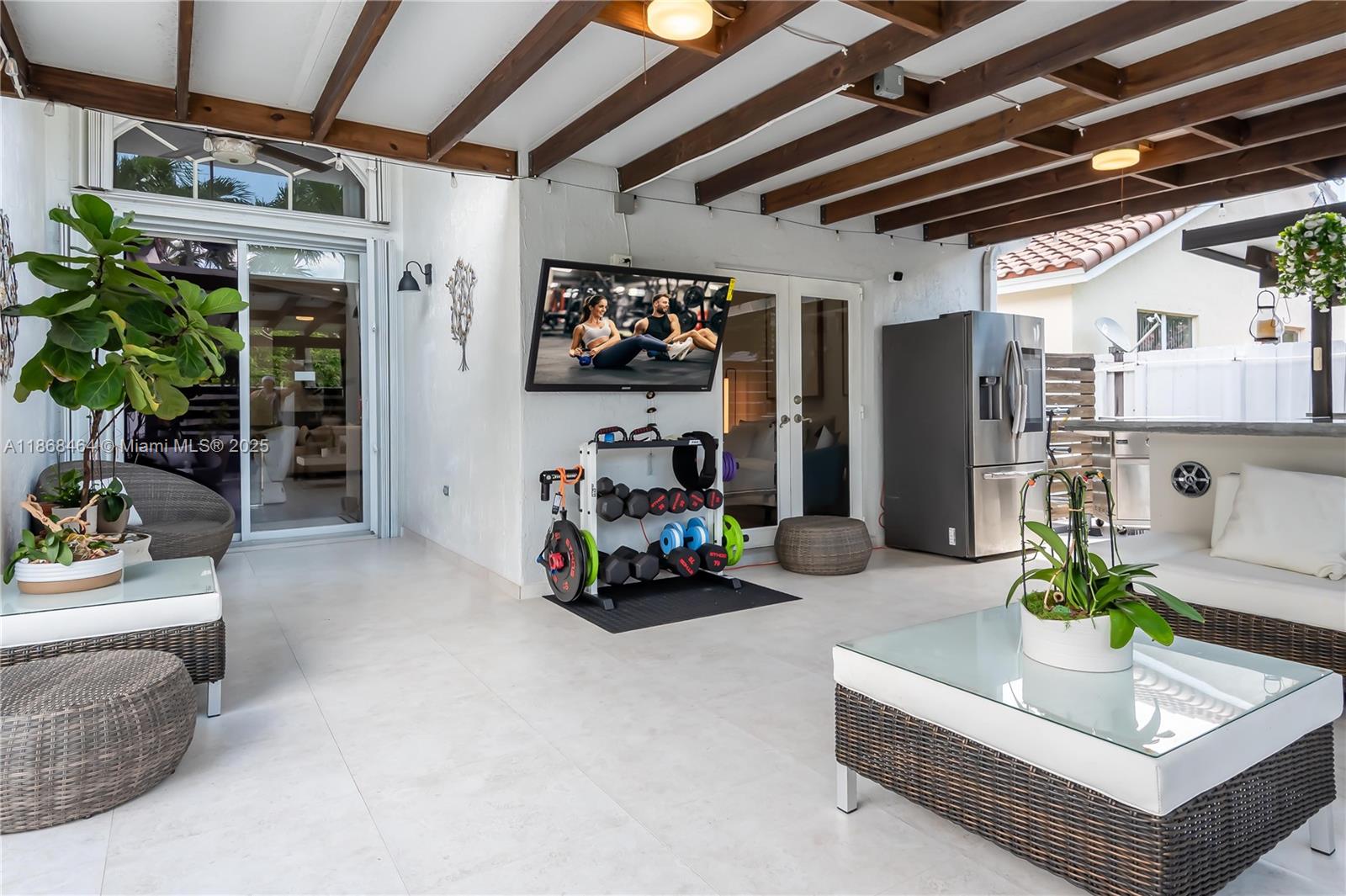 13348 Southwest 52nd Street Miramar, FL 33027 - Photo 36 of 48 a living room with furniture and a potted plant