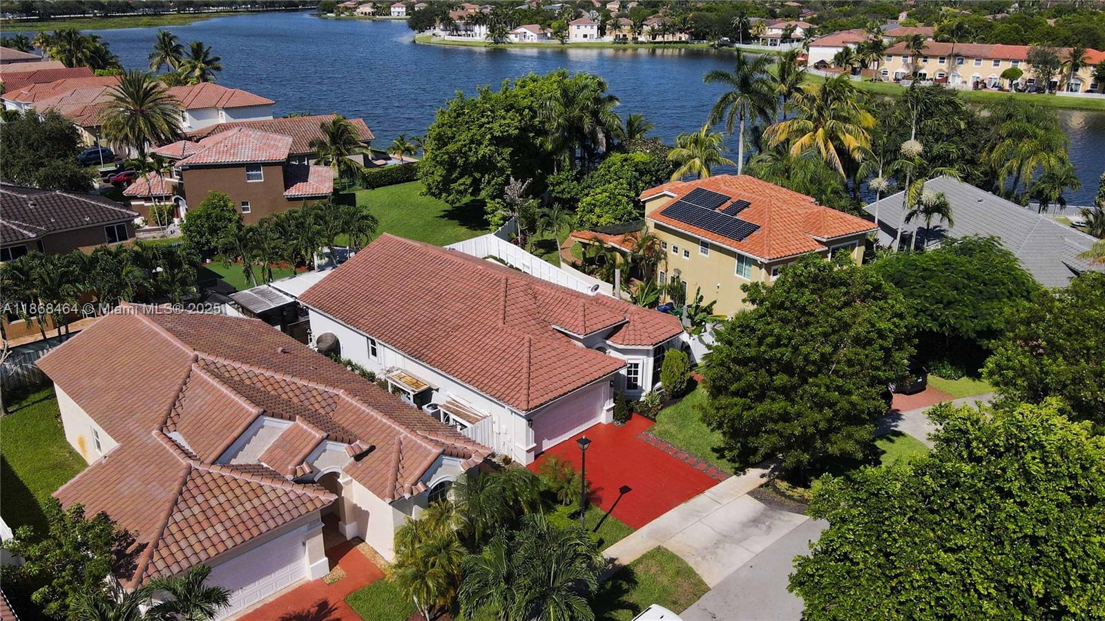 13348 Southwest 52nd Street Miramar, FL 33027 - Photo 40 of 48 an aerial view of multiple houses with yard