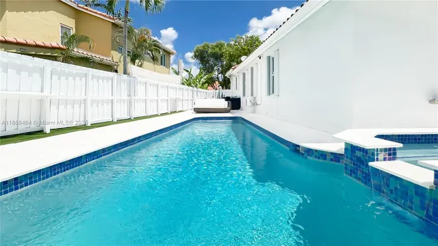 a view of swimming pool with a yard