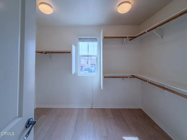 an empty room with a empty space and windows