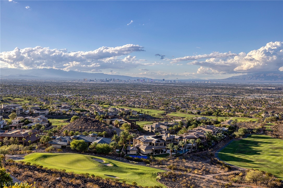 611 Cityview Ridge Drive Henderson, NV 89012 - Photo 57 of 66 Panoramas sweep across manicured fairways to the distant city skyline under vast blue skies.