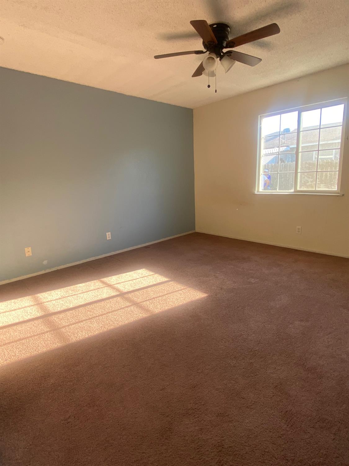 333 East Linden Avenue Reedley, CA 93654 - Photo 11 of 21 a view of an empty room with a window