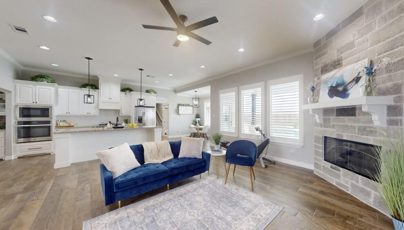 1508 North Blue Bonnet Lane Angleton, TX 77515 - Photo 3 of 11 a living room with furniture and a fireplace
