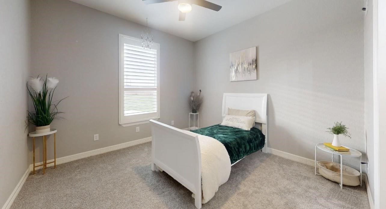 1508 North Blue Bonnet Lane Angleton, TX 77515 - Photo 8 of 11 a bedroom with a bed and a window
