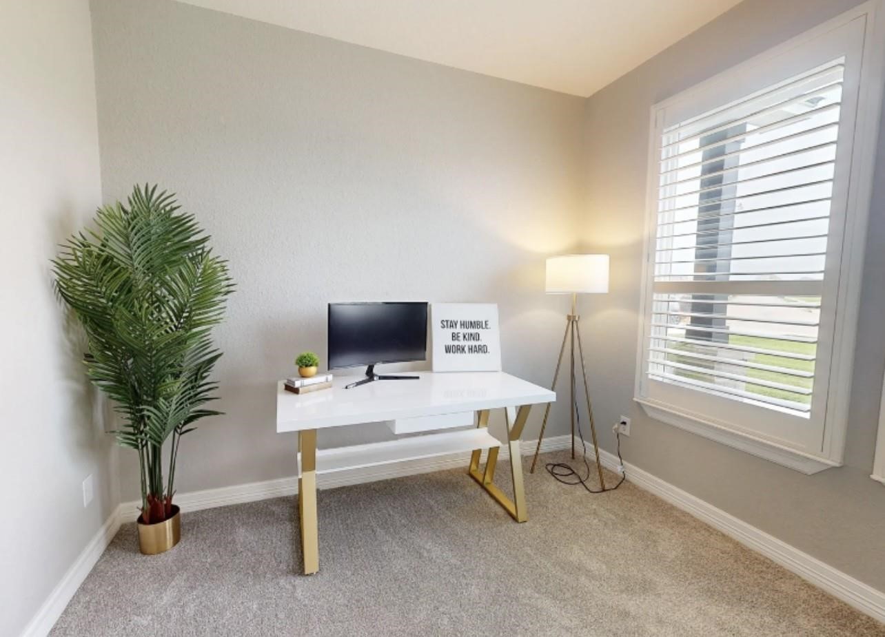 1508 North Blue Bonnet Lane Angleton, TX 77515 - Photo 9 of 11 a view of a livingroom with workspace and a window