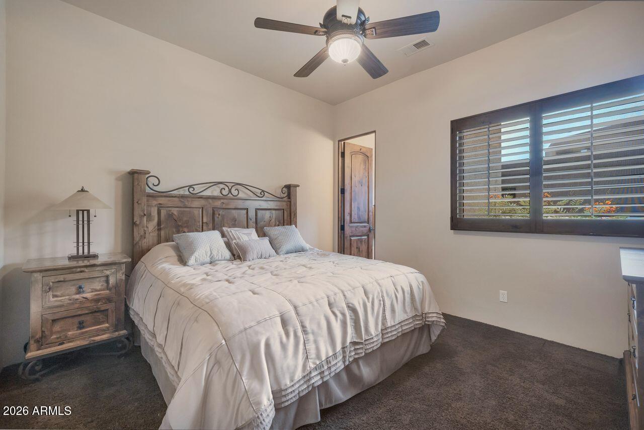 18507 East Picacho Road Rio Verde, AZ 85263 - Photo 22 of 33 a bedroom with a bed and a window